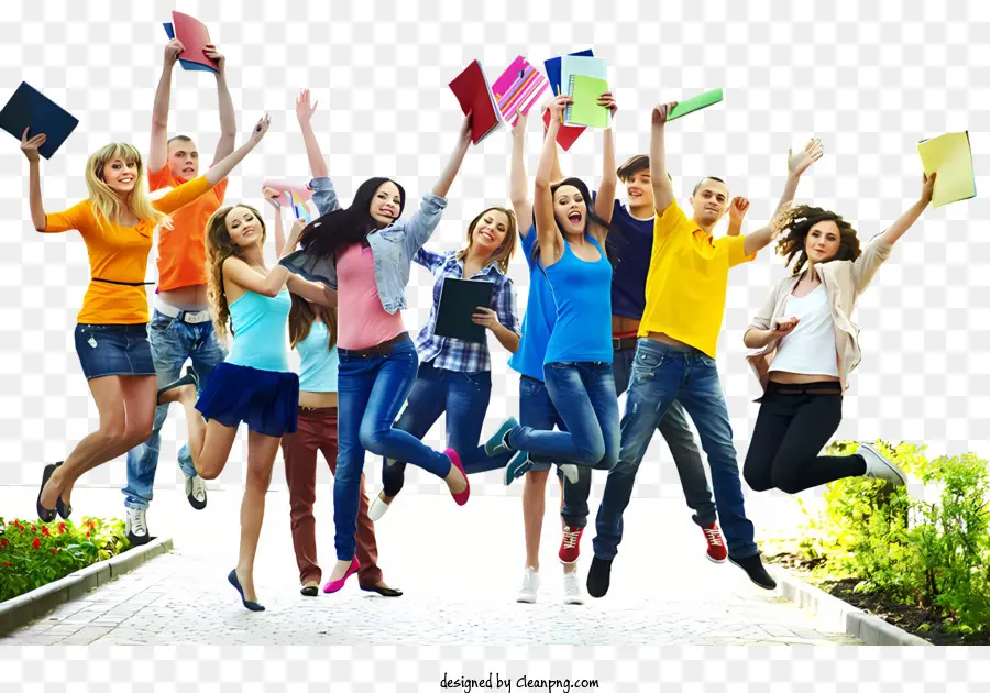 Promotion - Die Schüler springen glücklich mit Büchern und Stiften